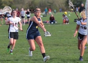 Sonia Olson shoots a goal in a game last year against Holy Names. (Photo credit Inside Bainbridge)