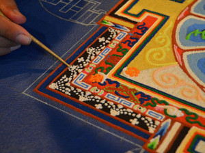 Making a sand mandala. Photo Credit: Gaden Shartse Monastic College