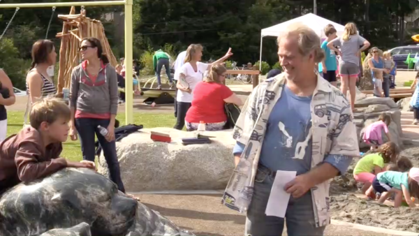 Sculptor Andre Pomeroy is delighted that so many children enjoy climbing on the great boulder he quarried and carved