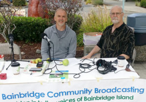 Darren Murphy, left, of the BI Fruit Club, chats with BCB Tech Chris Walker at the Farmers Market.