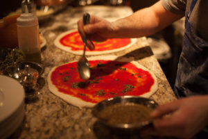 Preparing a classic Neapolitan pizza. Photo courtesy of Bruciato.